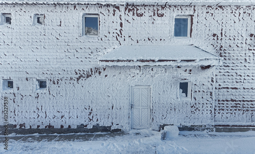 frozen house in winter scene