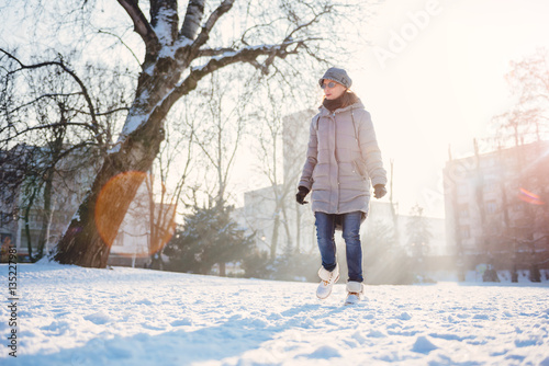 Woman walking in the snow © kerkezz