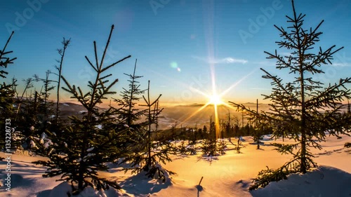 Motion controlled time-lapse of a winter panorama during the sunset in the polish mountains. photo