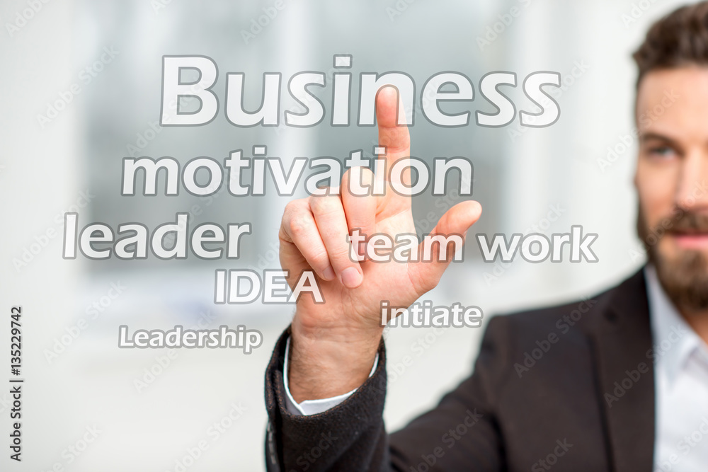 Man touching virtual word cloud on the business topic Man touching virtual word cloud on the business topic