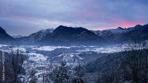 Majestic winter landscape with intensive sunset in Trentino, Ita