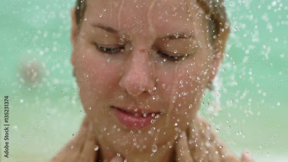 Sexy blonde woman taking outdoor shower slowmotion Sexy blonde woman taking outdoor shower slowmotion