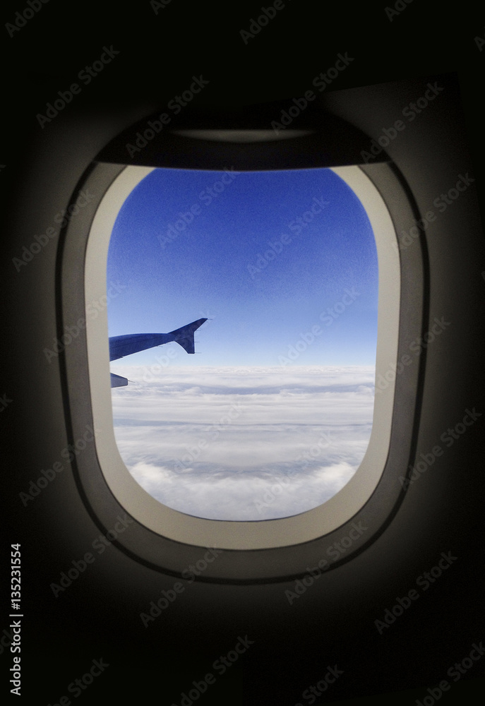Airplane porthole view of clouds. Airplane porthole view of clouds.