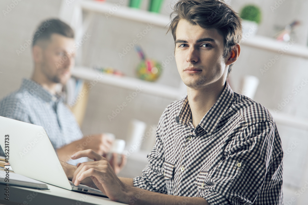 Man in office using laptop Man in office using laptop