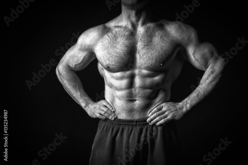 sexy muscular male torso with hairy chest of man workout