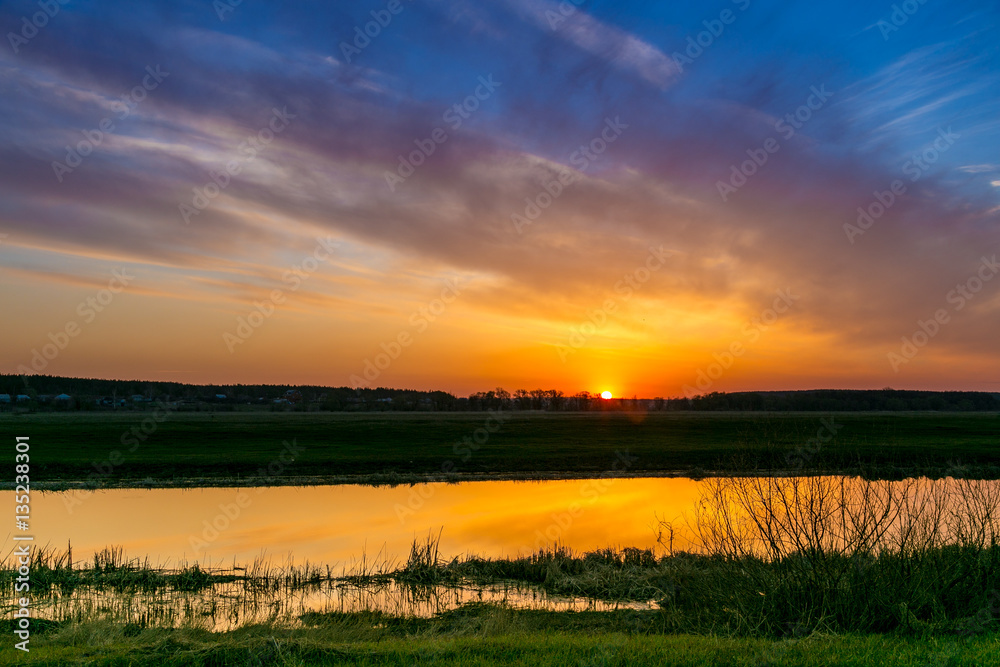 Spring dawn on the river Don is reflecting in calm water Spring dawn on the river Don is reflecting in calm water