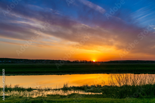 Spring dawn on the river Don is reflecting in calm water