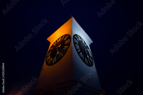 Petrovaradin fortress clock tower in the evening in Novi Sad, Serbia..Picture of the iconic clock of Petrovaradin fortress in Novi Sad, capital city of the provice of Voivodina, Serbia photo