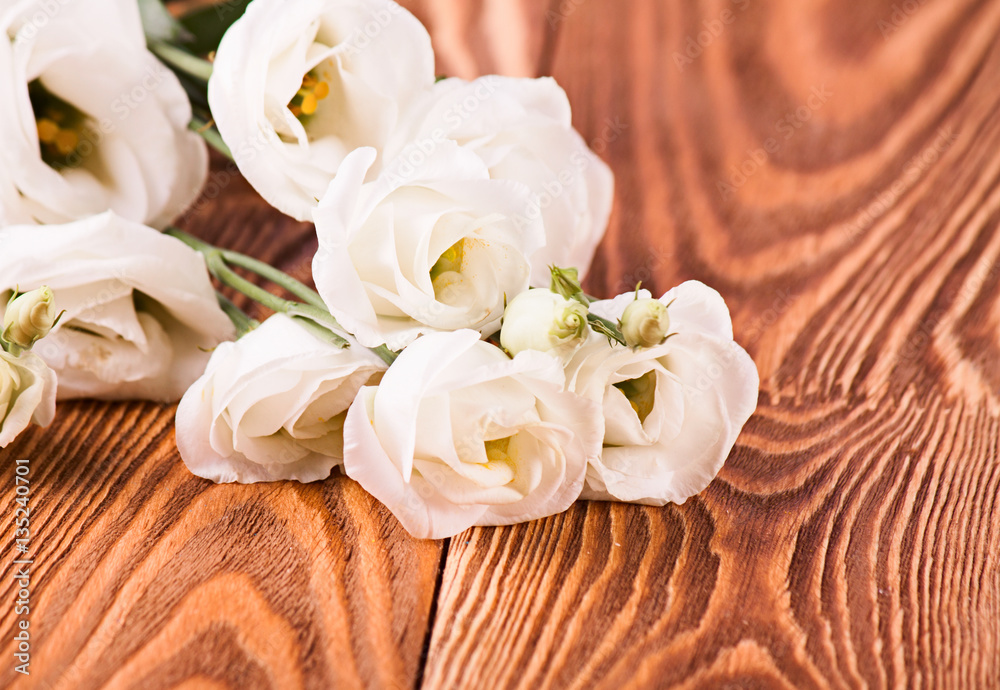 Fresh roses on wood desk Fresh roses on wood desk