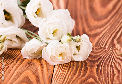 Fresh roses on wood desk