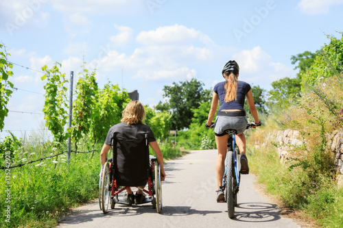 Young Couple In Wheelchair Enjoying Time Outdoors © nullplus