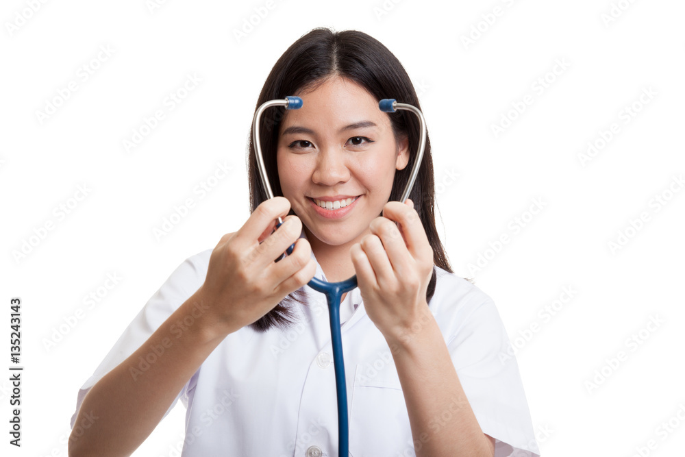 Young Asian female doctor show stethoscope focus at stethoscope. Young Asian female doctor show stethoscope focus at stethoscope.