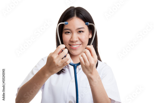 Young Asian female doctor show stethoscope focus at stethoscope.