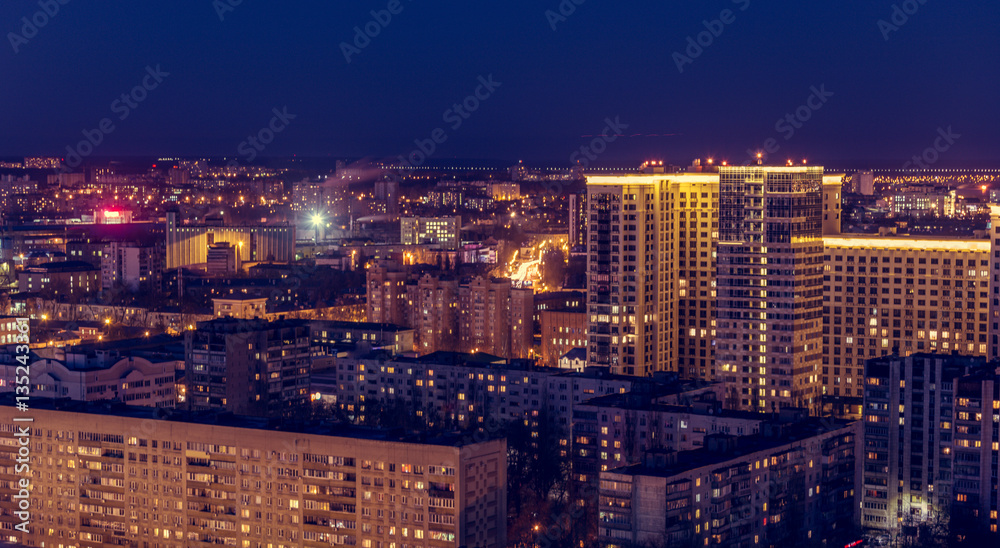 Voronezh downtown. Night cityscape from rooftop. Modern houses, hotels, streets