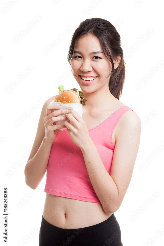 Beautiful Asian healthy girl enjoy eating hamburger. Beautiful Asian healthy girl enjoy eating hamburger.