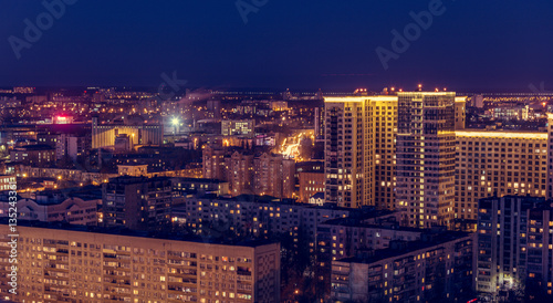 Voronezh downtown. Night cityscape from rooftop. Modern houses, hotels, streets