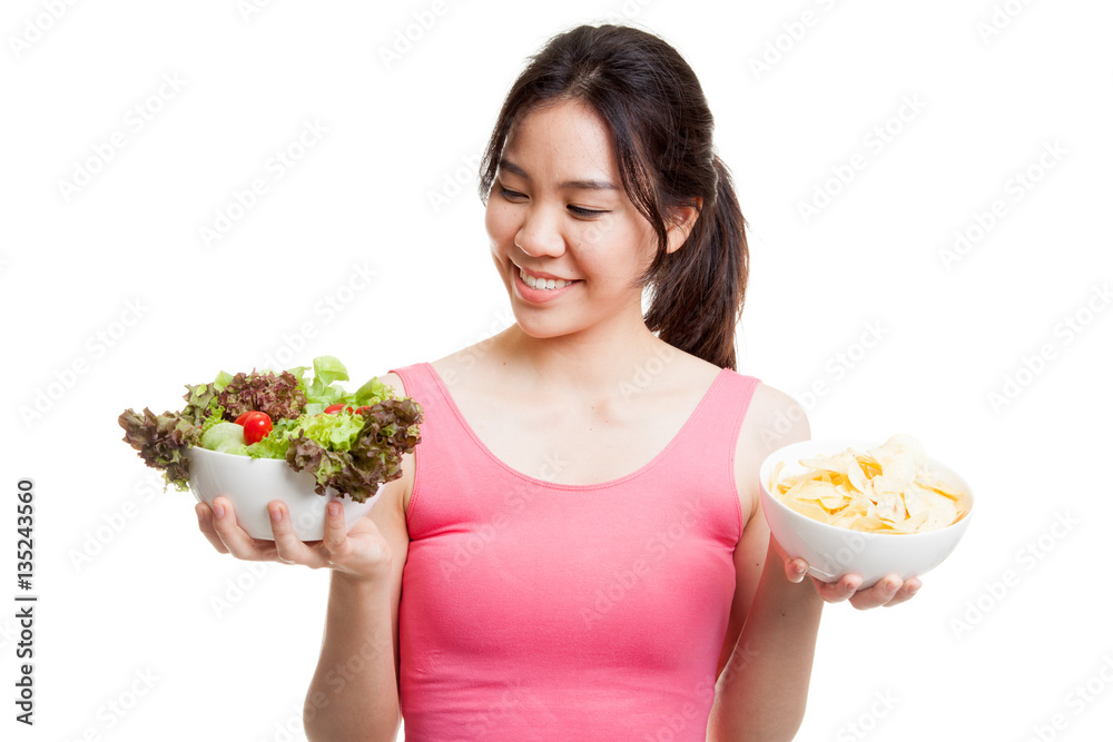 Beautiful Asian healthy girl salad and potato chips. Beautiful Asian healthy girl salad and potato chips.
