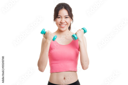 Beautiful Asian healthy girl exercise with dumbbell. © halfbottle