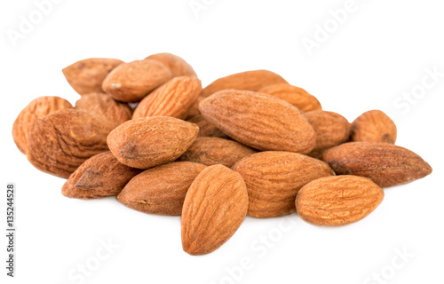 Almond closeup. Heap of shelled almond nuts isolated on white