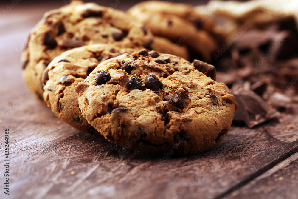 Chocolate cookies on wooden table. Chocolate chip cookies shot Chocolate cookies on wooden table. Chocolate chip cookies shot