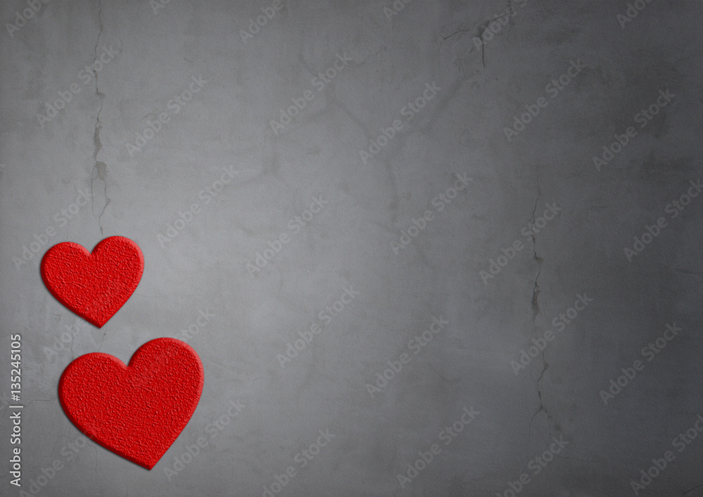 red hearts of stone on concrete texture background with cracks red hearts of stone on concrete texture background with cracks