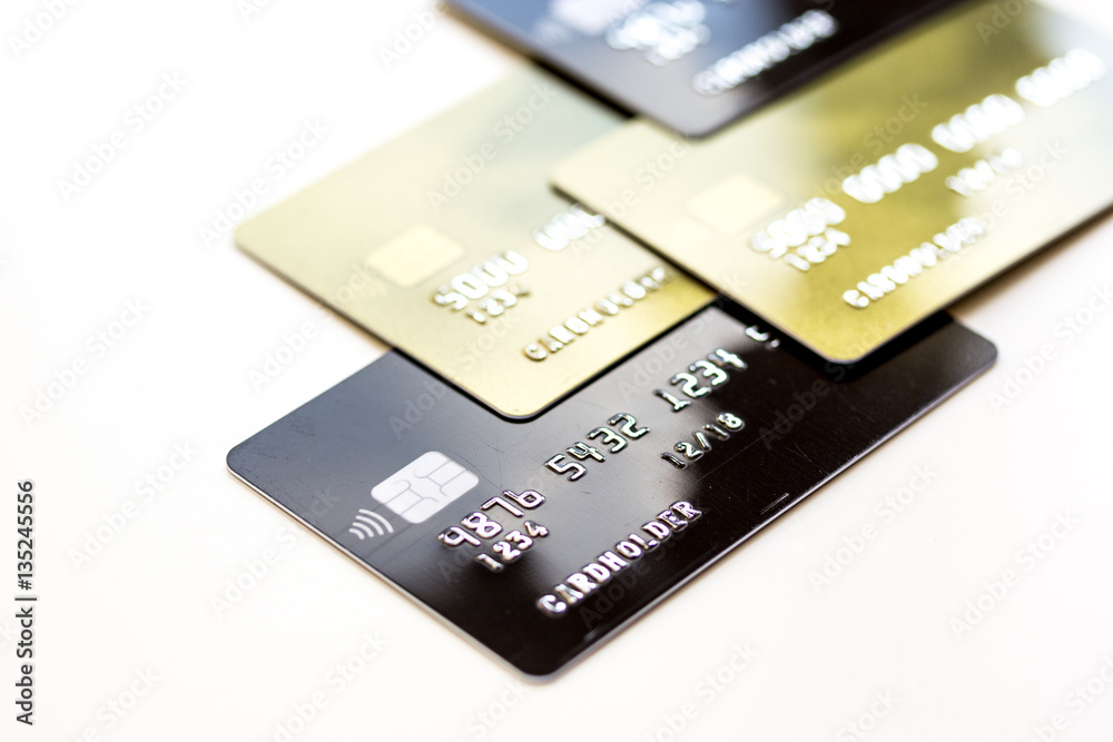 pile of credit cards on white background pile of credit cards on white background