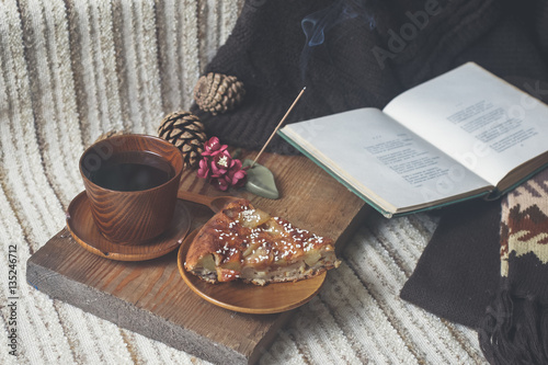 Pie, tea, book and Incense stick. Aromatherapy
