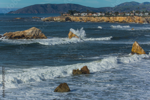 Waves crash on offshore rocks in Pismo Beach photo