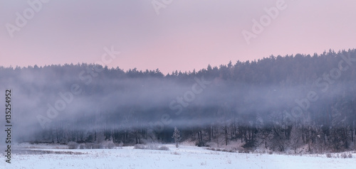 Fototapeta Naklejka Na Ścianę i Meble -  Rows of white fog over snow