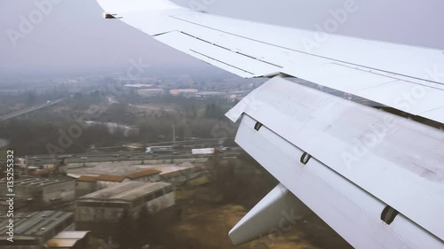 Wing of an Aircraft landing at Bergamo Orio al Serio Airport near Milan in Italy