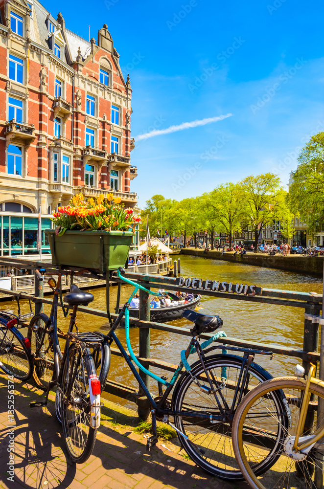Bikes on the bridge in Amsterdam, Netherlands. Canals of Amsterdam