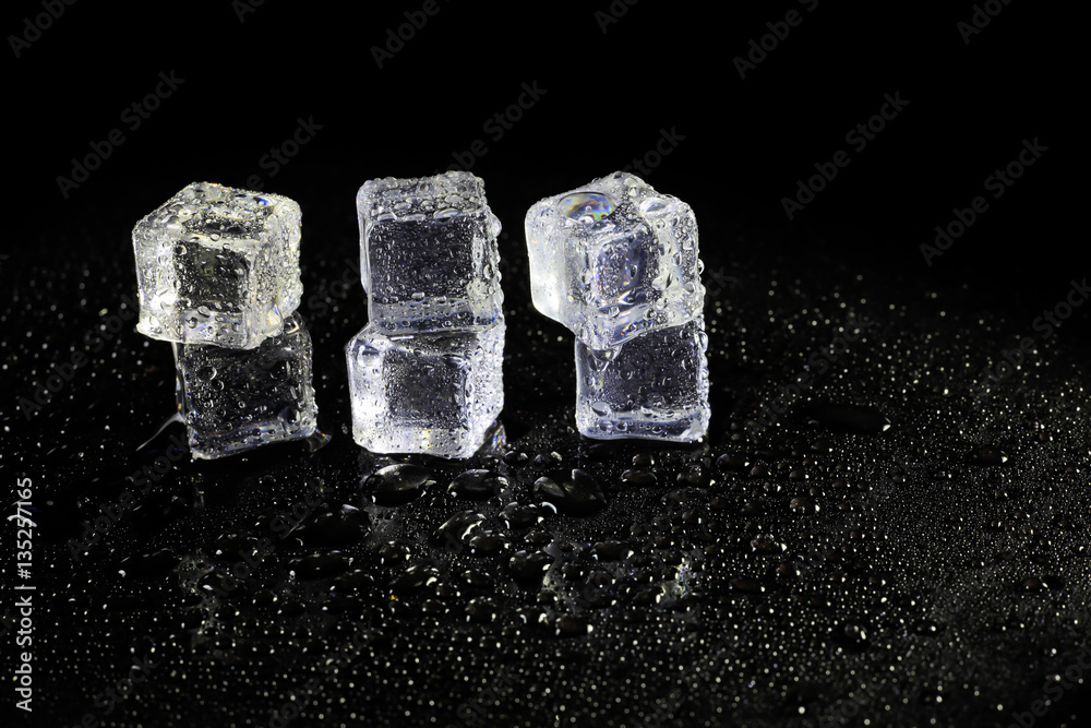 ice cubes reflection on black table background. ice cubes reflection on black table background.