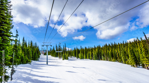 On the Chairlift during Spring Skiing at Sun Peaks in the Shuswap Highlands of central British Columbia, Canada
