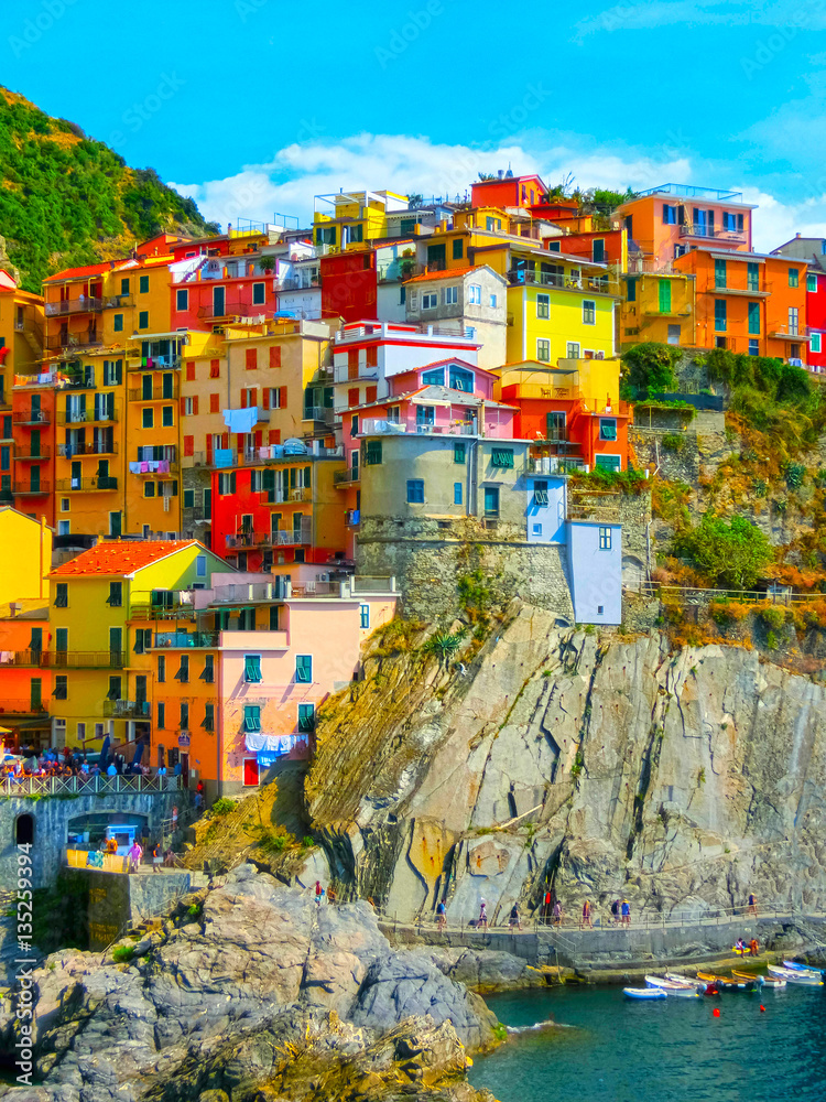 Colorful traditional houses on a rock over Mediterranean sea, Ma Stock ...