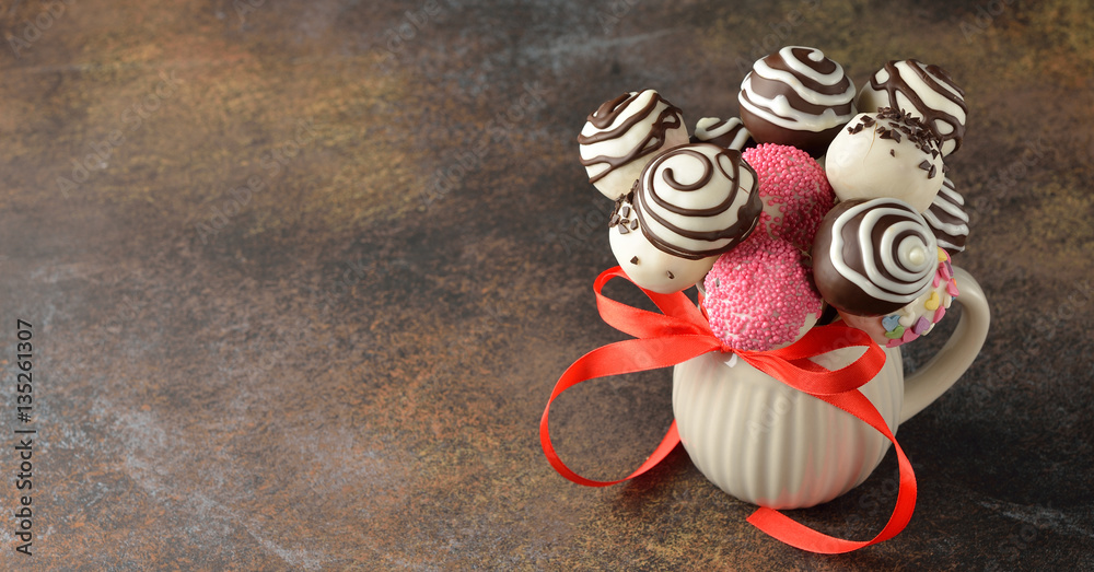 Cake pops decorated with white and dark chocolate