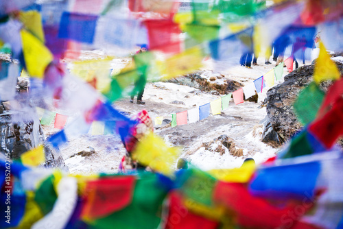 color prayer flags on top of Annapurna base camp