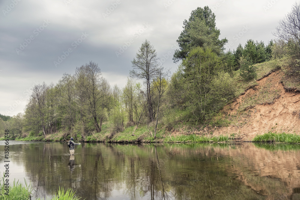 Fisherman casting fly rods.