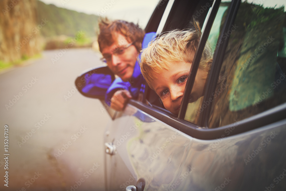 family travel by car- happy father with son on road