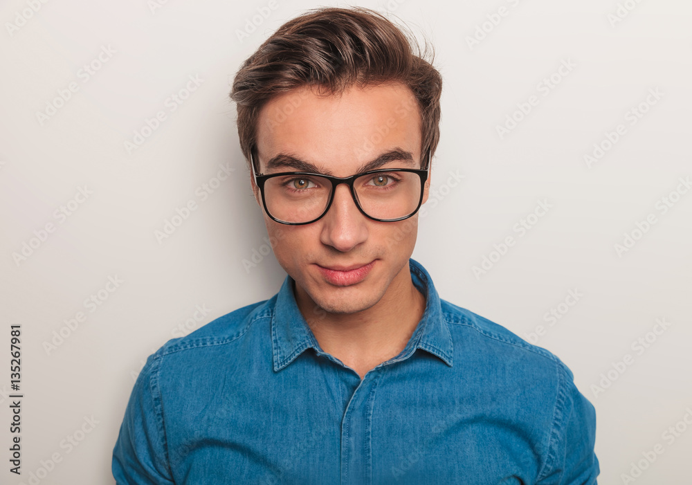 closeup picture of a young man wearing glasses