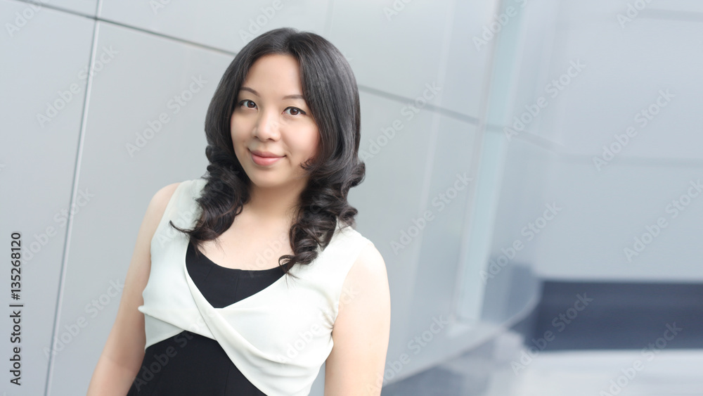 young asian business woman smile face on modern buliding backgro young asian business woman smile face on modern buliding backgro