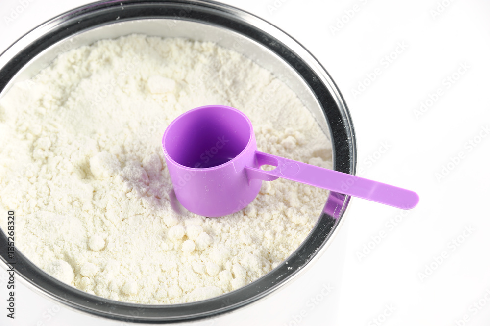 high angle view of baby formula and spoon in can high angle view of baby formula and spoon in can