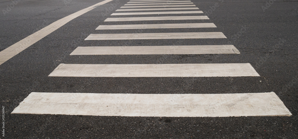 crosswalk on the raod in the city. crosswalk on the raod in the city.