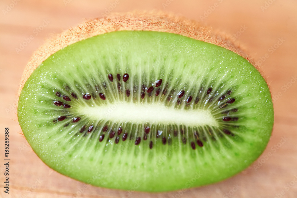 Kiwi fruit with green pulp and black seeds sliced Kiwi fruit with green pulp and black seeds sliced