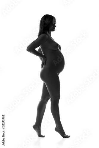 Beautiful naked pregnant woman isolated on white background  pregnancy nude concept