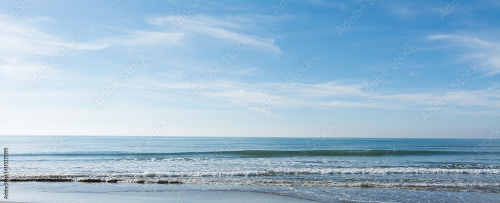 waves, sea and sun reflecting from the beach - background