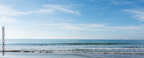 waves, sea and sun reflecting from the beach - background