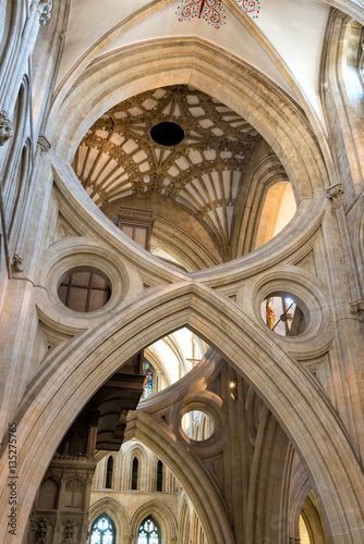 Wells, United Kingdom - August 6, 2016: St Andrew's Cross arches under the tower inside Wells Cathedral photo