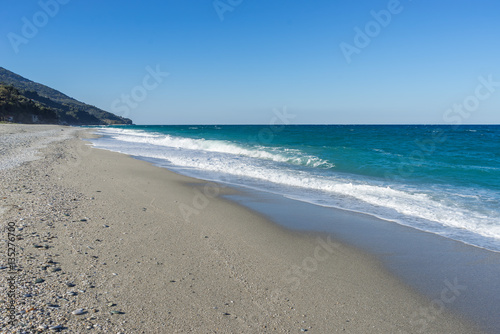 View on Mediterranean Sea with sunny sand beach. Chorefto village, Pelion, Greece. 