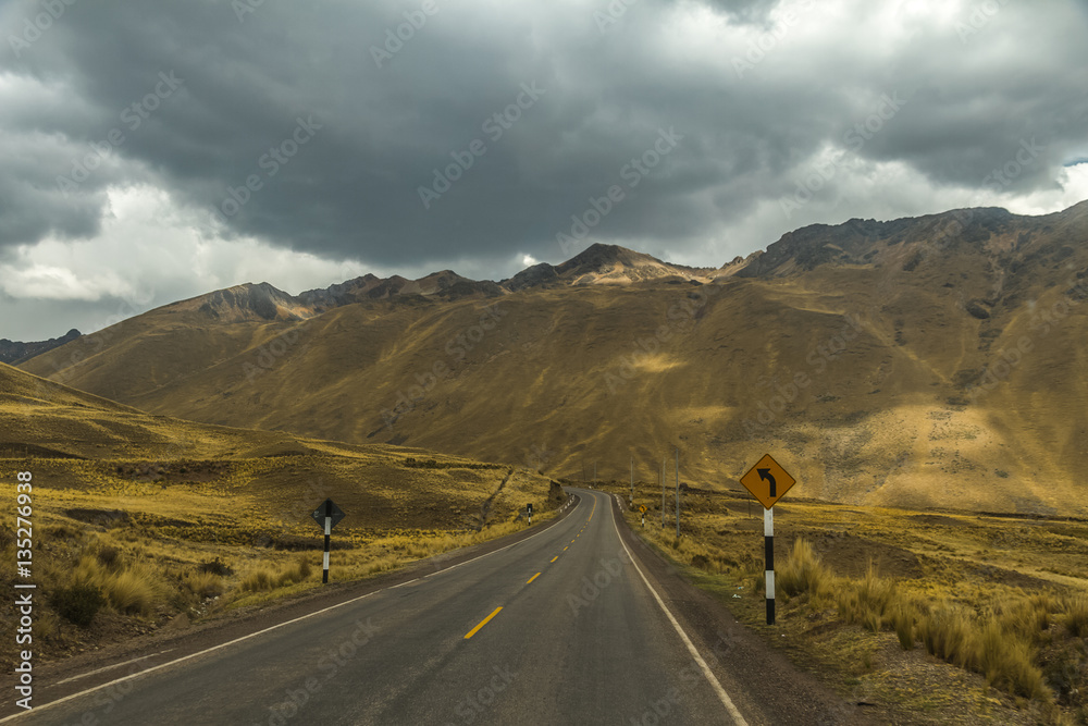 Fototapeta premium Mountain road in Andes, Peru. Cloudy day.