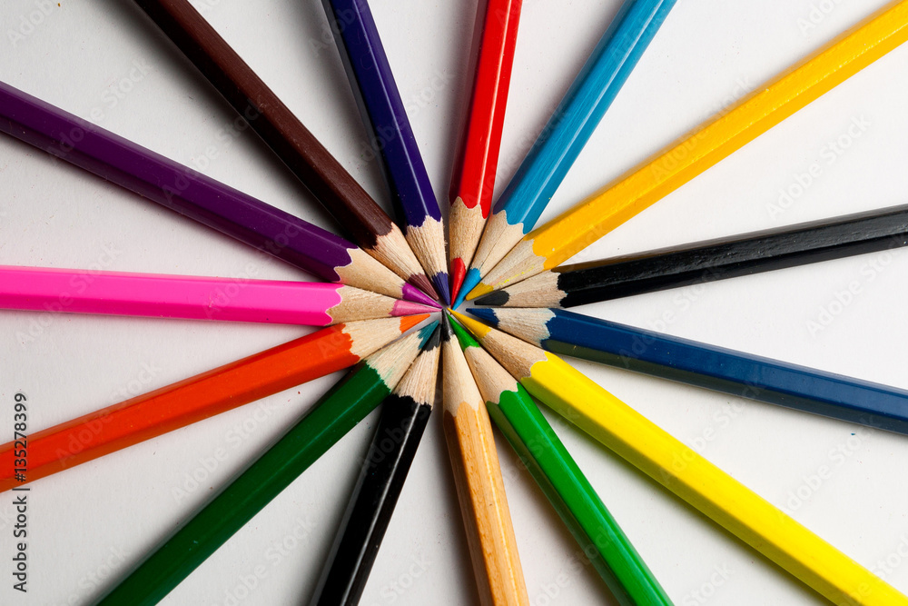 Photo of planed colored pencils on the light background